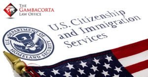 U.S. citizenship and immigration services paperwork and an American flag