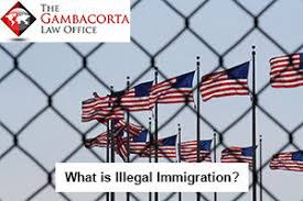 American flags as seen through a chain link fence